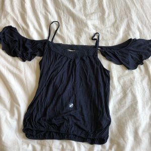 Blue tank with exposed shoulders